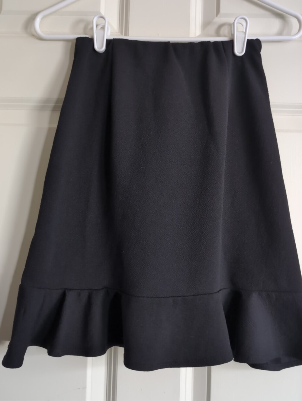 Vintage black above the knee skirt with ruffle hem